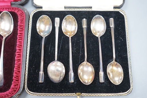 Two cased sets of six silver tea or coffee spoons including late Victorian with sugar tongs.